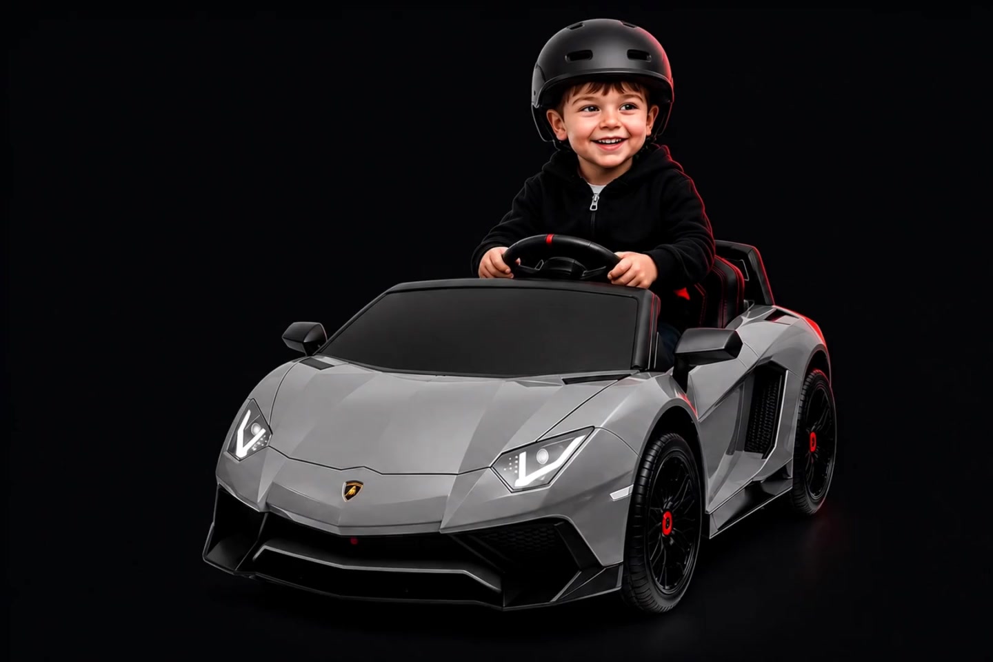 Concept: a smiling helmeted child in a grey miniature sports car